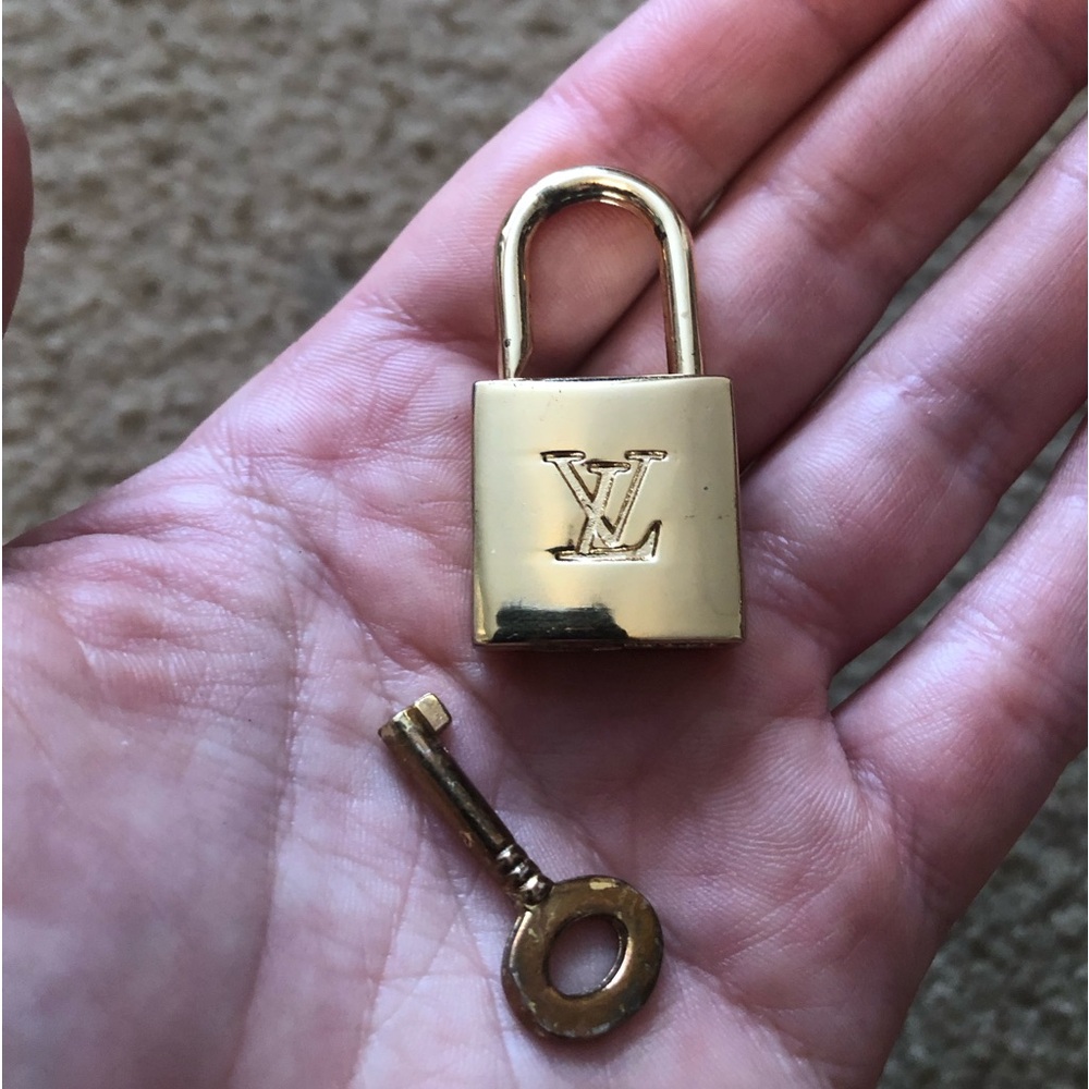 louis vuitton padlock with key gold tone used